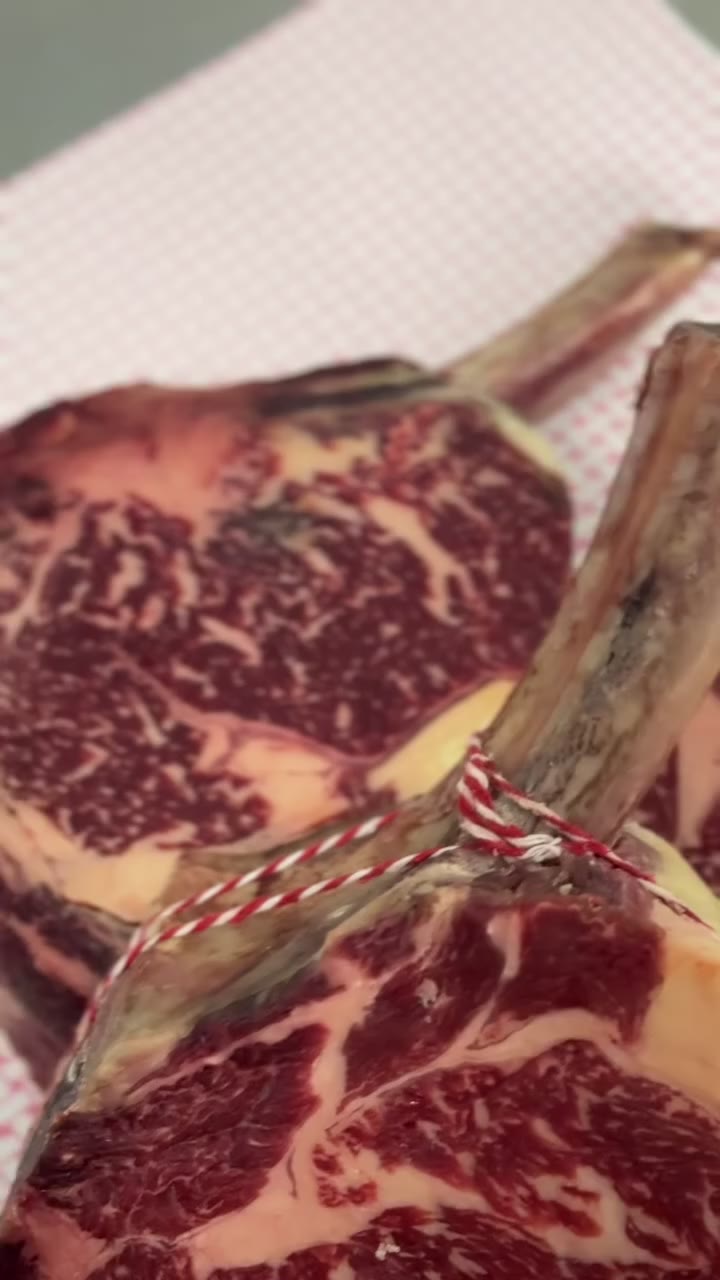 Dry-aged tomahawk with deep marbling
